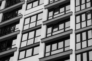 windows of a residential apartment building. a loan for housing. mortgage